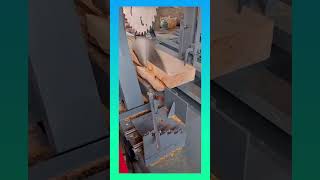 Precision woodworking in action machine slices timber smoothly, turning raw logs into perfect boards