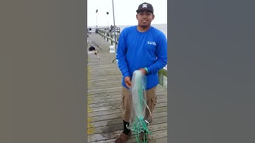 Throwing a cast net with one arm