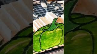 Chisel carves leaf design into wooden surface