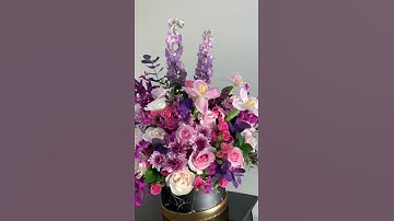 Thumbnail of A  shades of purple, pink and white flower arrangement.