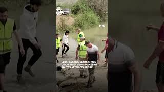 Lebanese residents cross Litani river using improvised crossings following ceasefire