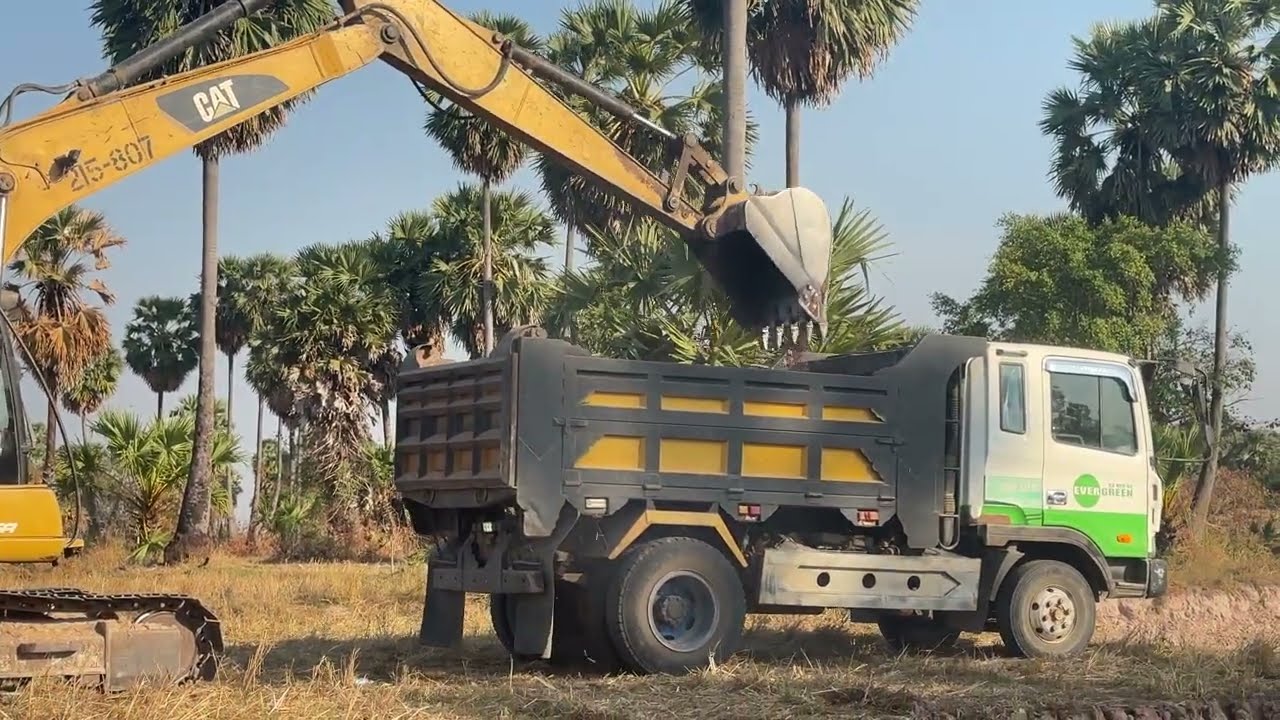 Caterpillar 313C Excavator Loading Trucks - Pyramis Ate