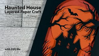 Cutting Paper to Create Haunted House Art