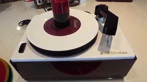 RCA 45-J-2 record changer playing a stack of 45 RPM records STEREO