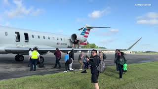 American flight evacuated; video shows passengers on wing