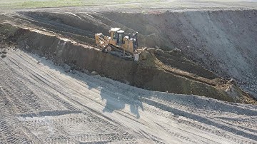 Caterpillar D9T Bulldozer Levelling Huge Old Mining Area - Drone View