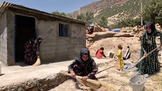 Akram cleans her nomadic house with Fariba