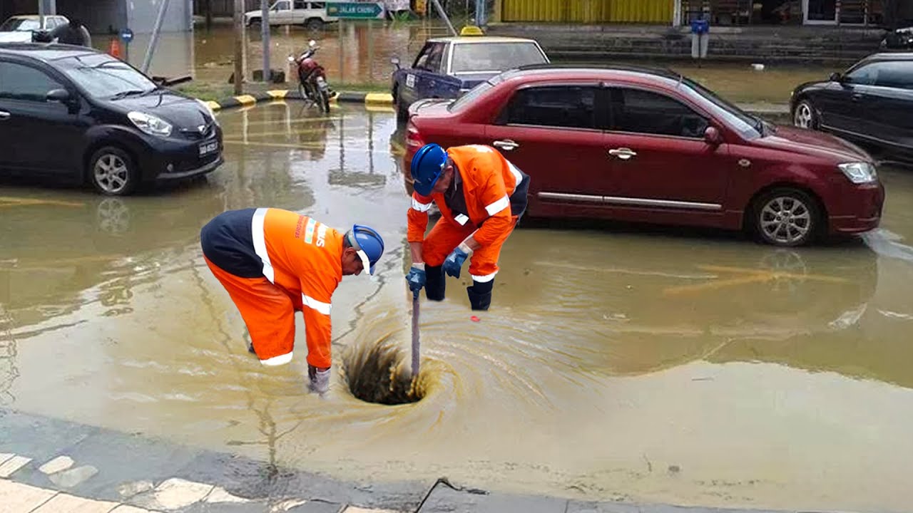 Massive Street Flood Clearing a Storm Drain to Save the Street - YouTube