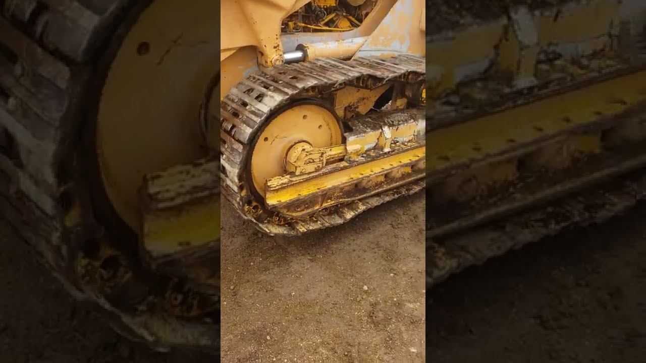 Caterpillar dozer Cat crawler loader with rusty tracks track is rusted badly
