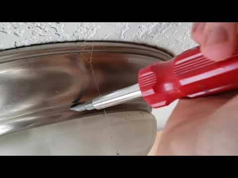 How to remove a stuck twist on glass shade light fixture