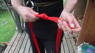 Make a chest or waist harness from rope or tape.