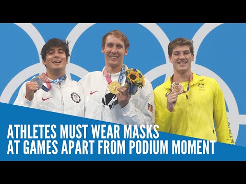 Medalists allowed maskless photo-op on podium