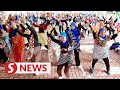 Hundreds give Zumba a batik twist