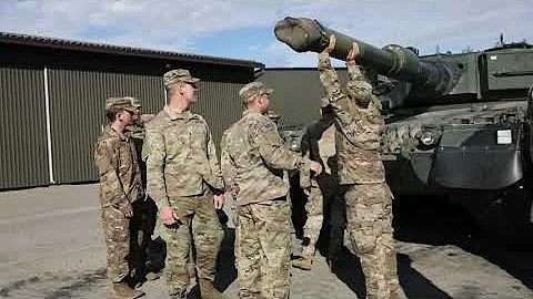 U.S. Soldiers explore the Finnish Leopard battle tank
