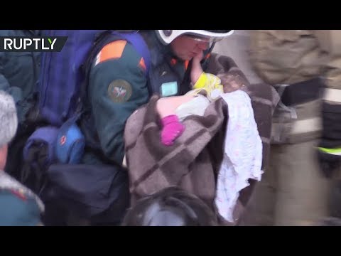 Dramatic moment baby pulled alive from under rubble after 35hrs in freezing cold in Magnitogorsk