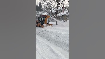 When sidewalks disappear under deep snow, the Trackless Twin Auger Snowblower gets to work!