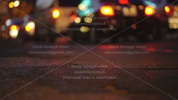 Colorful traffic lights bokeh circles on night city street. Abstract background