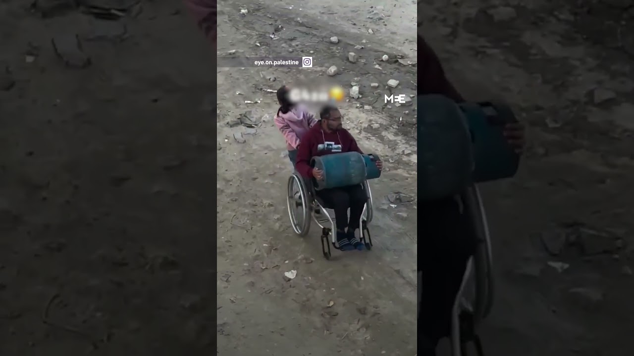 Video shows Gaza girl struggling to pull father’s wheelchair to transport gas cylinder