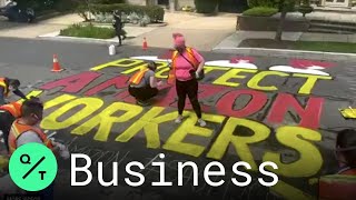 Activists Paint Mural Outside Jeff Bezos's Home to Demand PPE for Amazon Workers