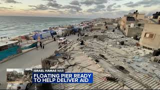 US military says first aid shipment has been driven across a newly built US pier into the Gaza Strip