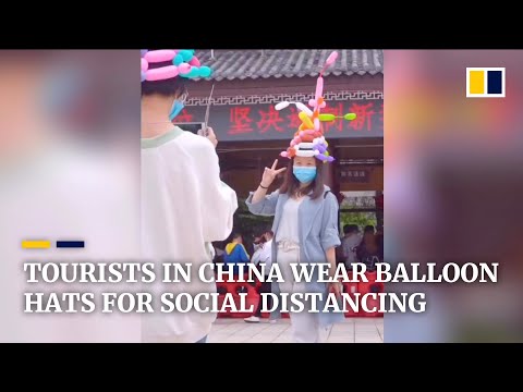 Tourist spot in China provides visitors with free balloon hats to maintain social distancing