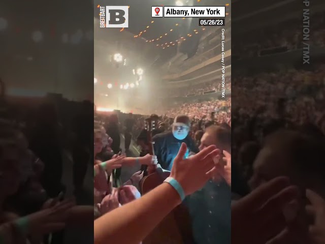 GET HER OUT OF HERE! – Country Star Zach Bryan Kicks Fan Out of Concert for Grabbing His Guitar class=