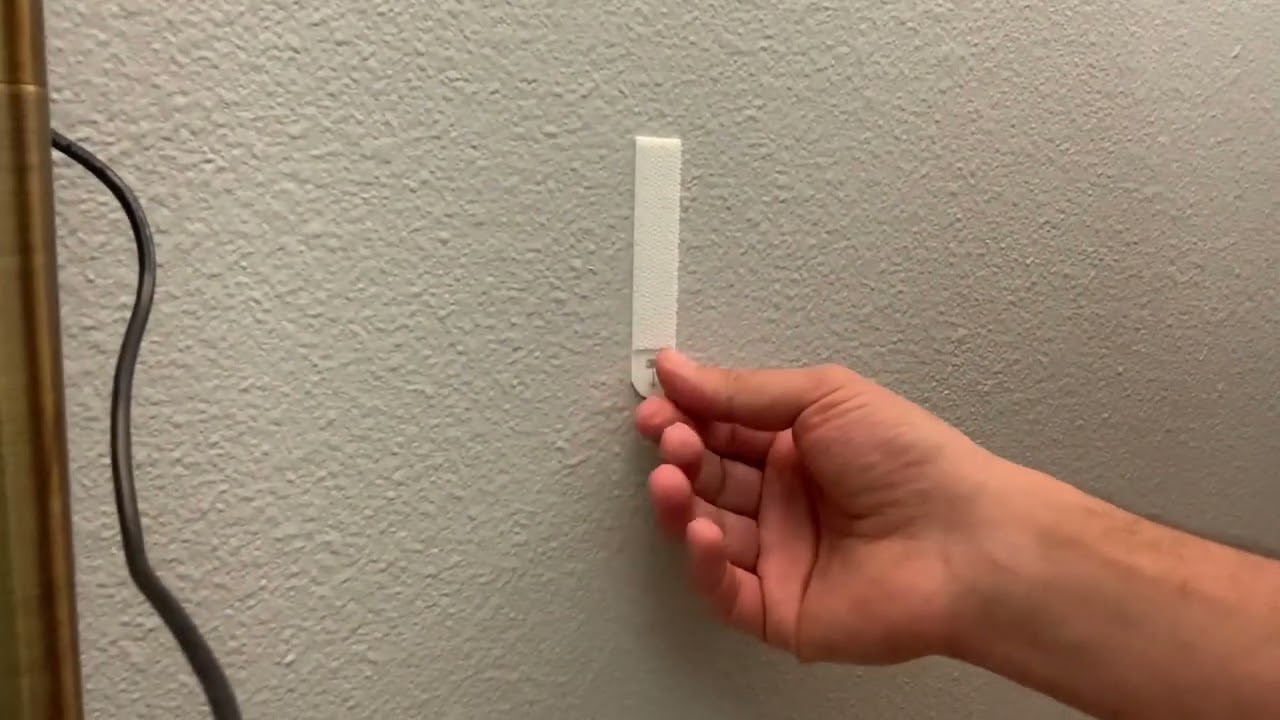 How to Remove Command Strips (Without Damaging Your Walls!) - The