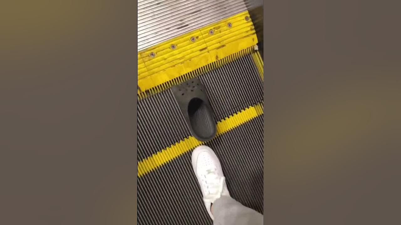 Cinderella lost her croc on Disneyland escalator.. Cinderella lost her croc on Disneyland escalator..