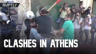Police tear gas students protesting business reforms in Athens