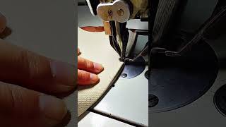 Thick canvas fabric stitched firmly with worn sewing machine