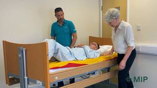 Assisted Move Up Bed With 2 Flat Slide Sheets With a More Dependent Patient