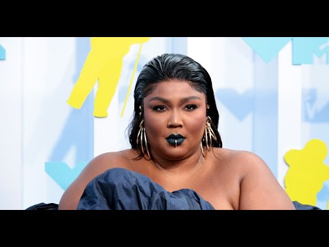 Lizzo unleashes curves in plunging string bikini as she dances on hotel ...