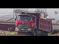 Truck dumping garbage between Marcus Garvey and Industrial Terrace