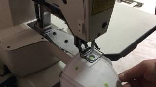 Eyelet sewing machine for caps