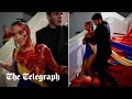 Protester dressed in Ukrainian flag colours drenches herself in fake blood on Cannes red carpet