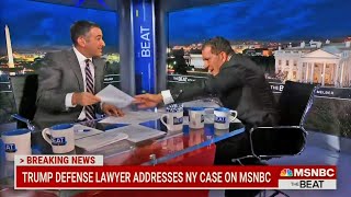 Trump's lawyer lunges at host in live TV meltdown