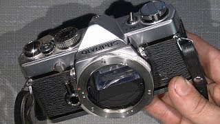 How to take off the top cover on Olympus OM-1 and other details