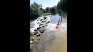 Guy Slips On His Back As He Runs Into A River