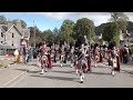 Massed Pipes and Drums march to the 2019 Braemar Gathering in Royal Deeside, Aberdeenshire, Scotland