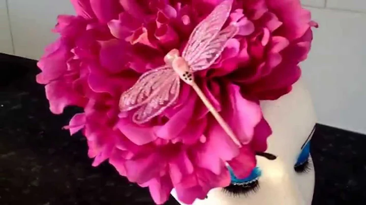 Fascinator with large pink flower and dragonfly