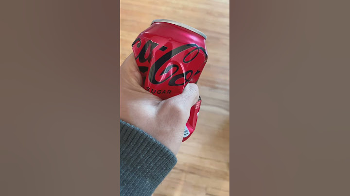 Watch empty coke can being crushed.