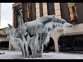 A big snowstorm leaves frozen icicles on an iconic city statue
