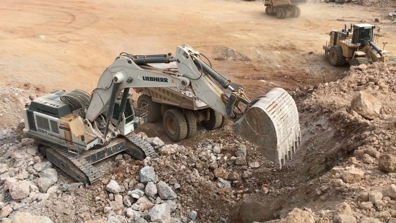 Liebherr 984 Excavator Loading Caterpillar Dumpers And Operator View - Sotiriadis Ate