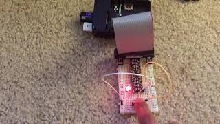 raspberry pi program that causes an led to blink when a push button is not pressed YV6p