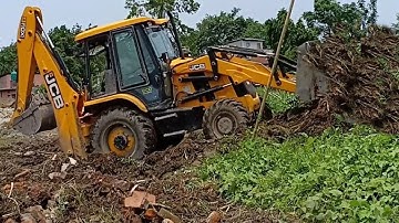 JCB Backhoe Levels Ground And Finishes Loading Sand