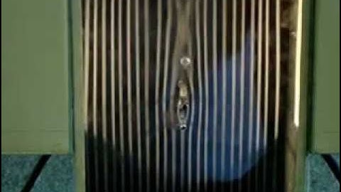 high speed flow visualization around two cylinders by using smoking wind tunnel