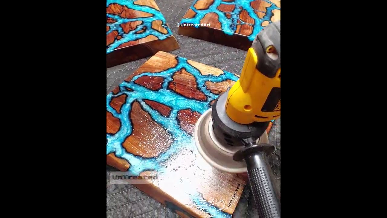 Pouring teal epoxy resin into burned fractal rivers