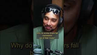Why do scubadivers fall backwards