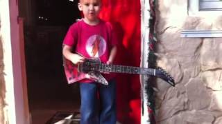 Jaden playing the guitar