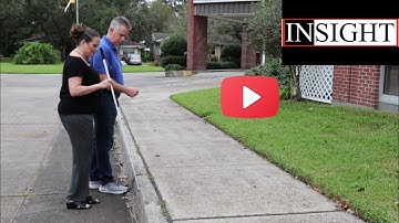 What is the best method to guide someone who is blind or has low vision?